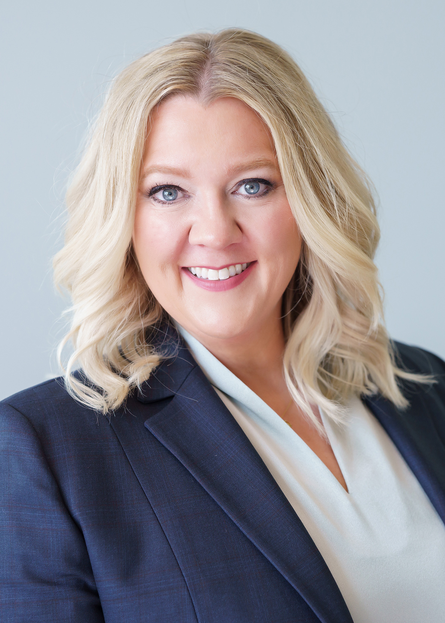 Hosanna Noelle in a navy blazer, AI and Operations Architect at HNH Consulting